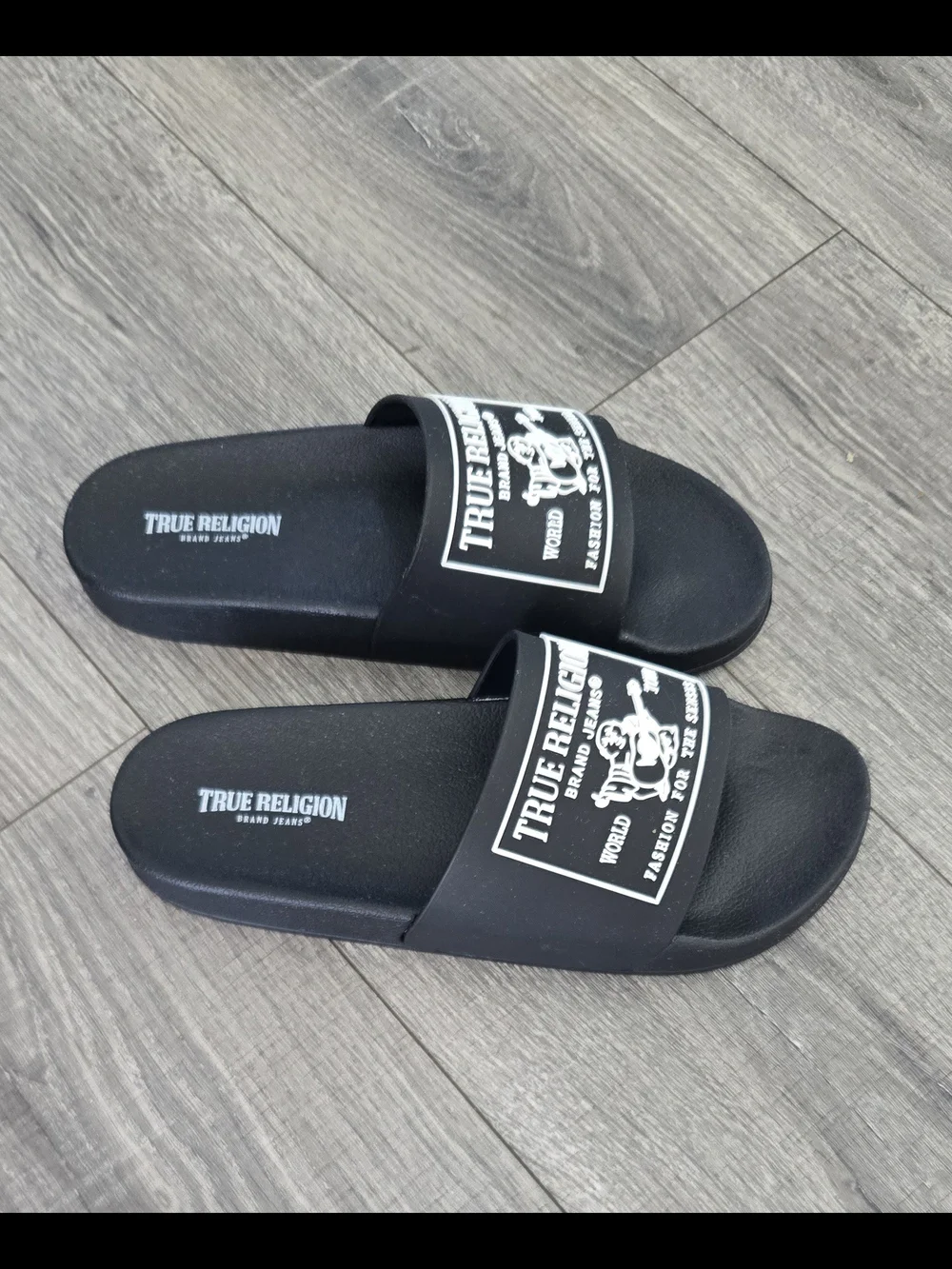 NWOT True Religion black slide sandals in men’s US size 9.